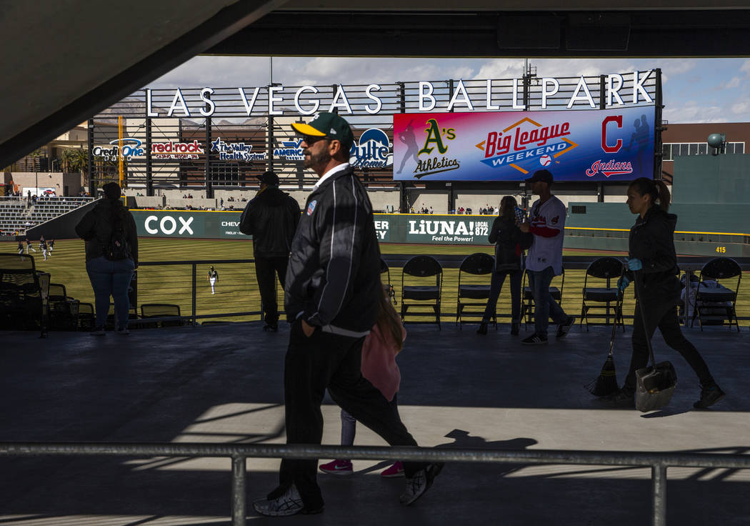 Fans walk in the stadium as the Cleveland Indians and Oakland Athletics play during a Big Leagu ...
