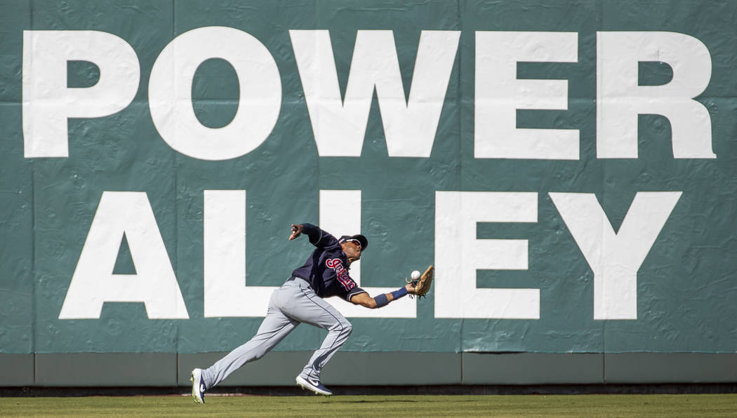 Cleveland Indians outfielder Greg Allen (1) bobbles a long fly ball hit by the Oakland Athletic ...