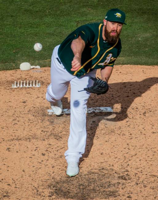 Oakland Athletics pitcherBrian Schlitter (54) releases another ball towards a Cleveland Indians ...