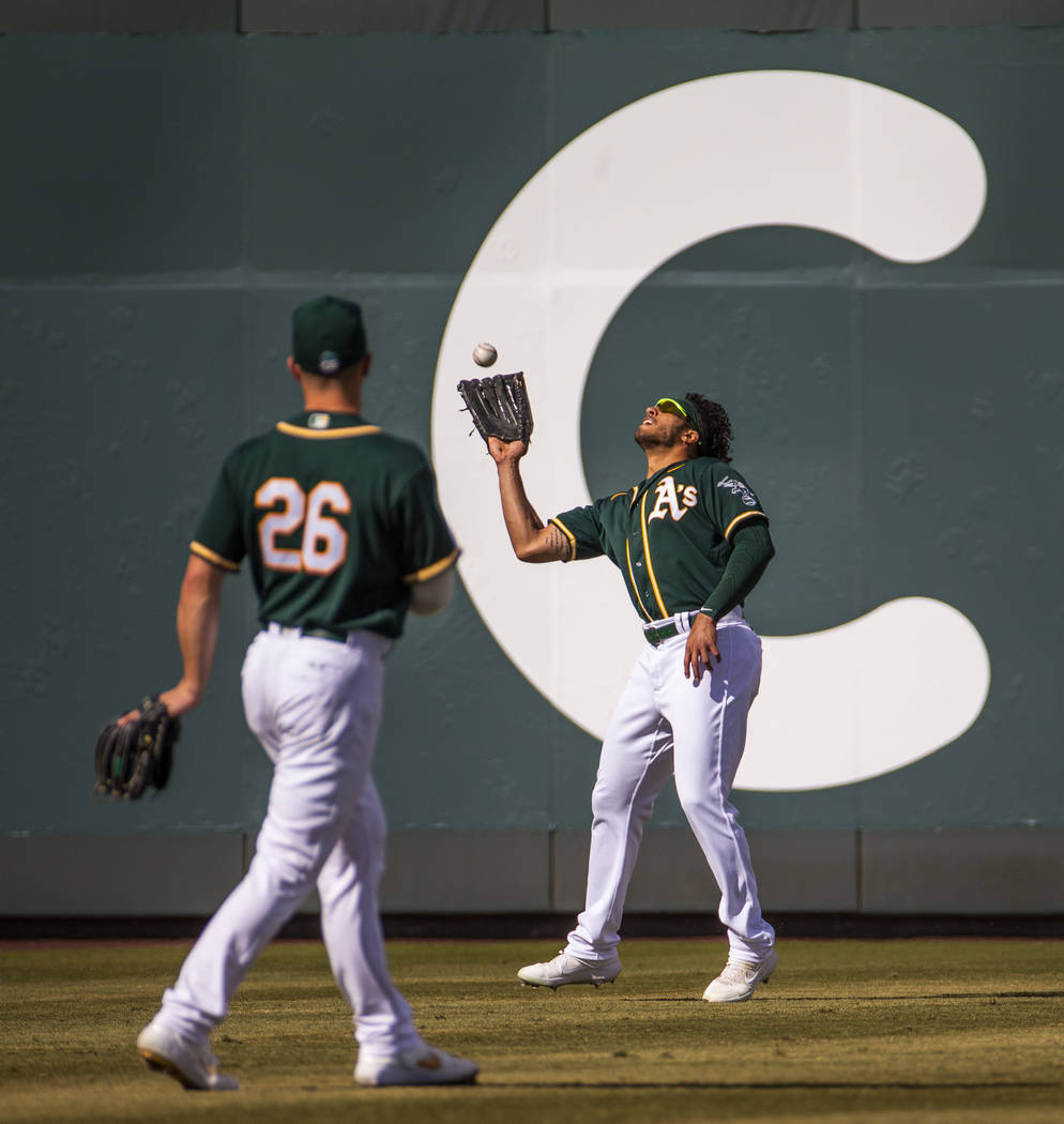Oakland Athletics outfielder Dillon Thomas (71) looks in a long fly ball by the Cleveland India ...