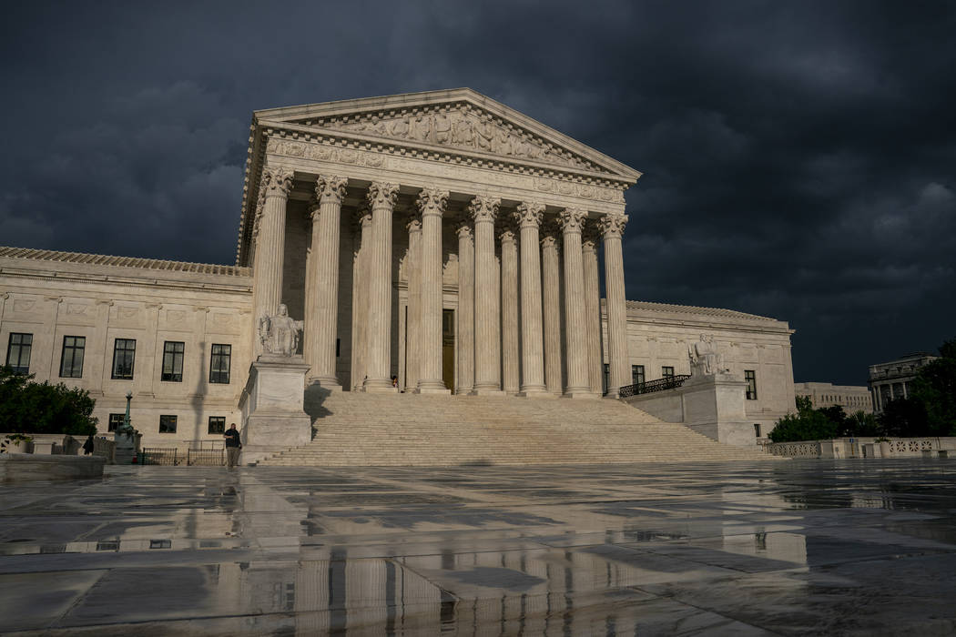 FILE - In this June 20, 2019, file photo, the Supreme Court is seen under stormy skies in Washi ...