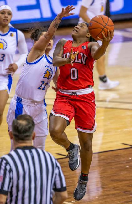 UNLV Lady Rebels guard LaTecia Smith (0, right) looks to lay in the ball over San JosŽ St ...