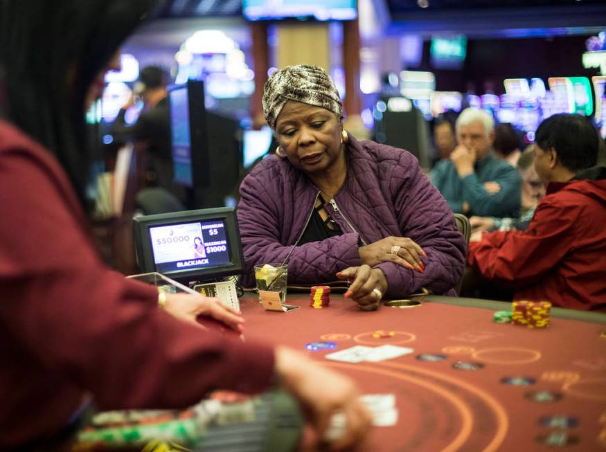 Barbara Wright, of Las Vegas, plays blackjack at Rampart Casino in Las Vegas, Sunday, March 1, ...