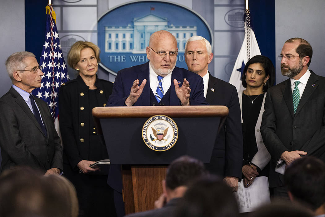 Director of the Centers for Disease Control and Prevention Robert Redfield, center, with from l ...