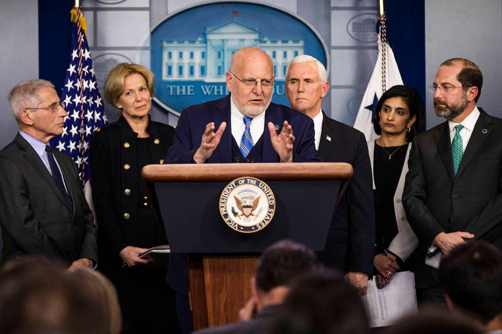 Director of the Centers for Disease Control and Prevention Robert Redfield, center, with from l ...