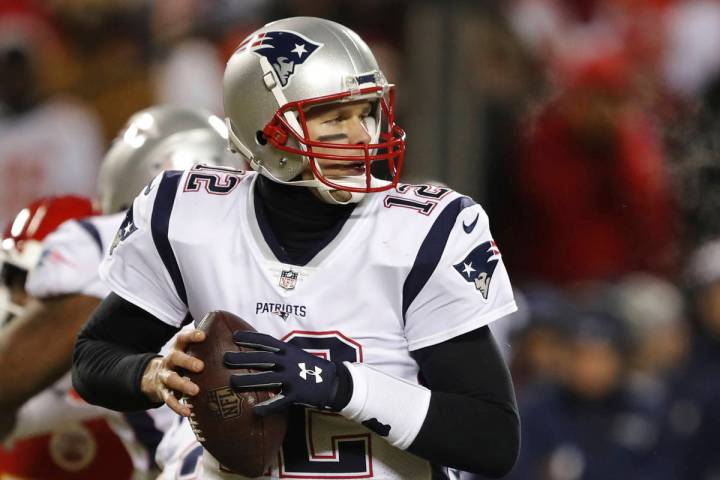 New England Patriots quarterback Tom Brady looks for a receiver during the first half of the AF ...