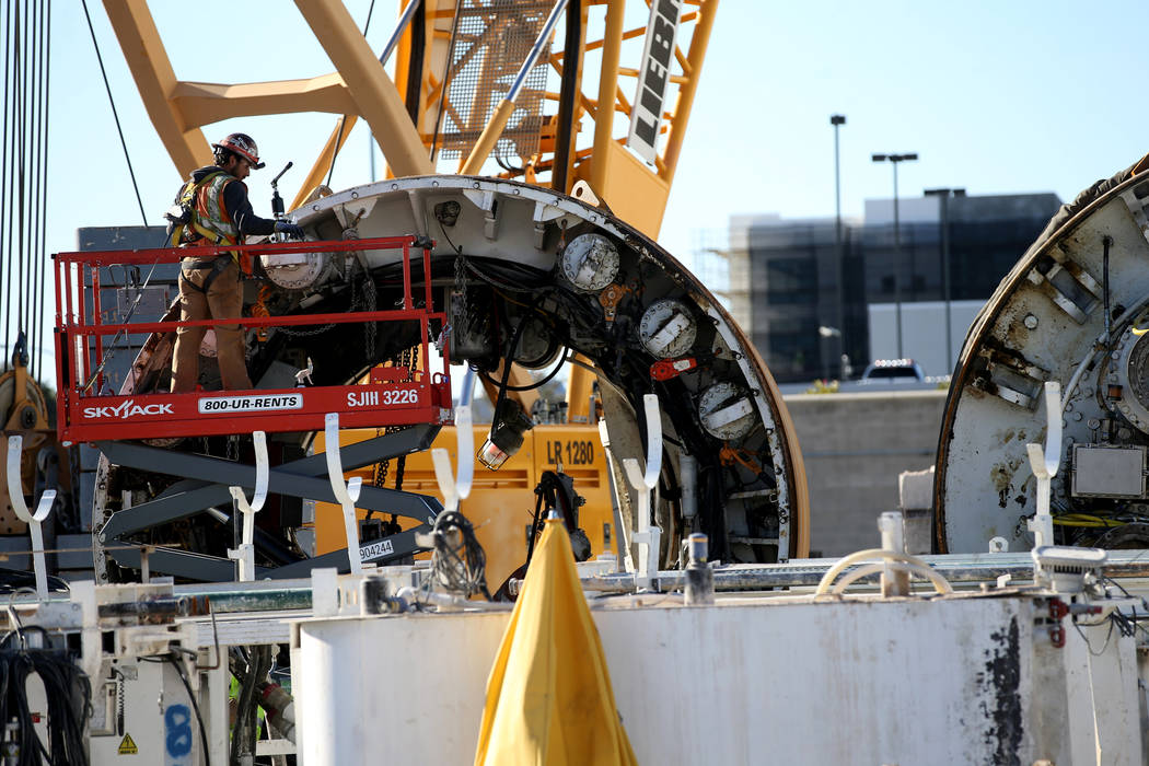 The Boring Co. workers prepare to lower the drill assembly to begin work on the second tunnel i ...