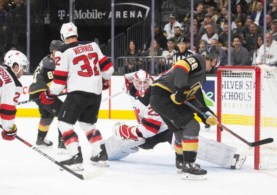 Vegas Golden Knights center Paul Stastny (26) is stoned by New Jersey Devils goaltender Mackenz ...