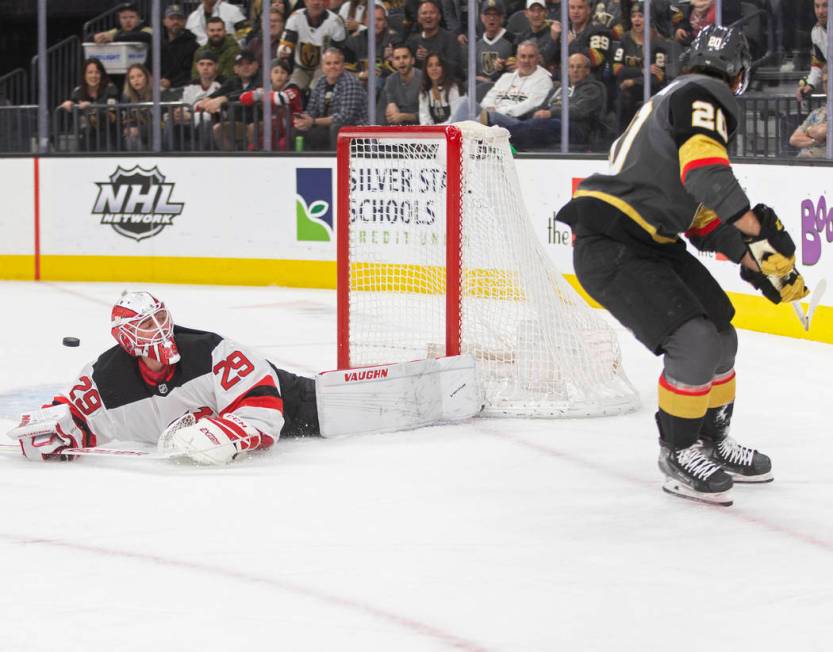 New Jersey Devils goaltender Mackenzie Blackwood (29) makes a diving save against Vegas Golden ...