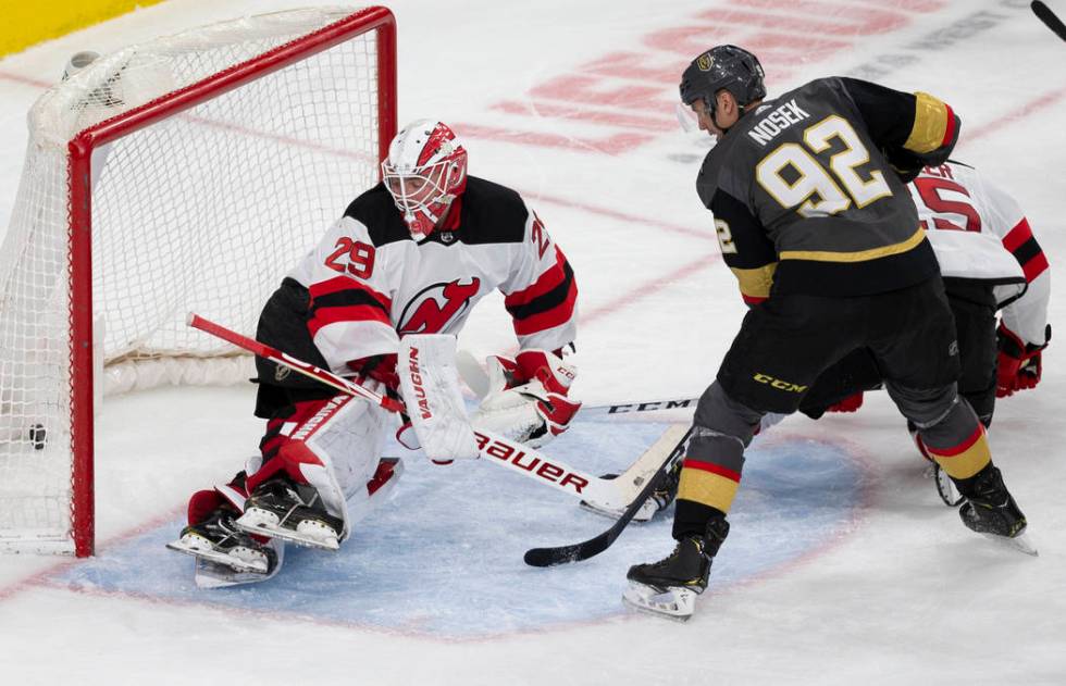 Vegas Golden Knights left wing Tomas Nosek (92) watches a shot from Vegas Golden Knights right ...