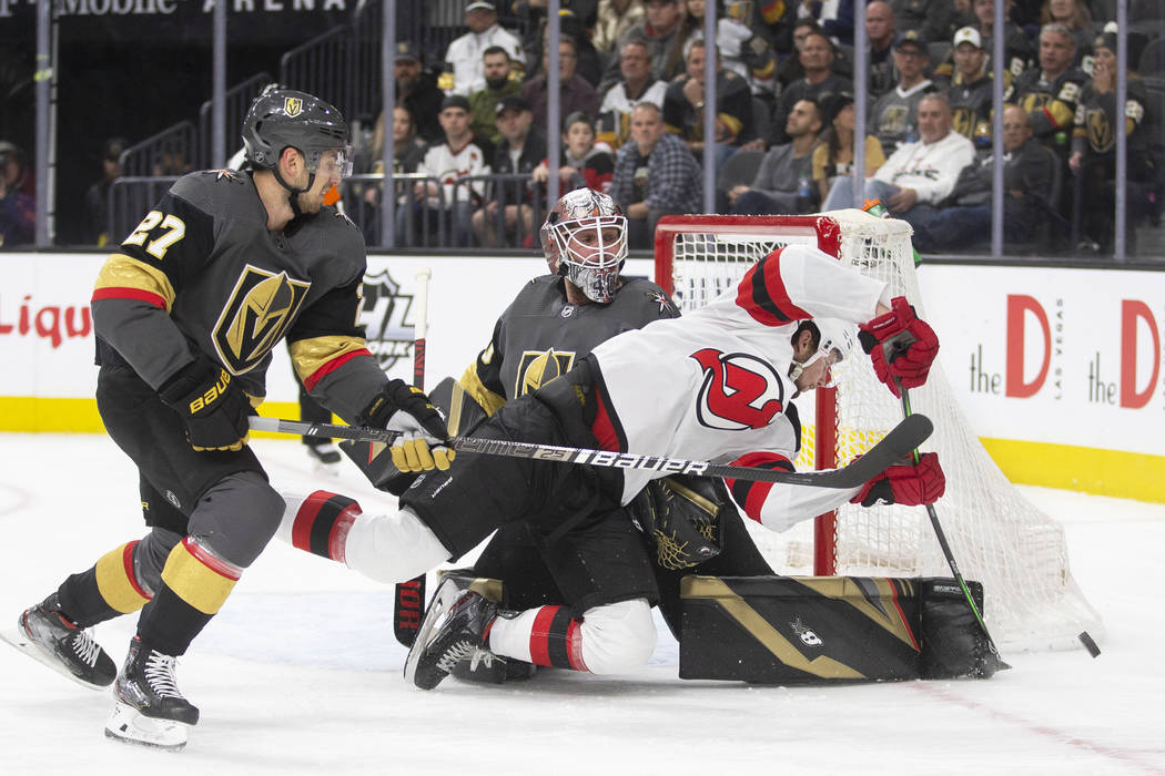 Vegas Golden Knights goaltender Robin Lehner (90) makes a save against New Jersey Devils left w ...