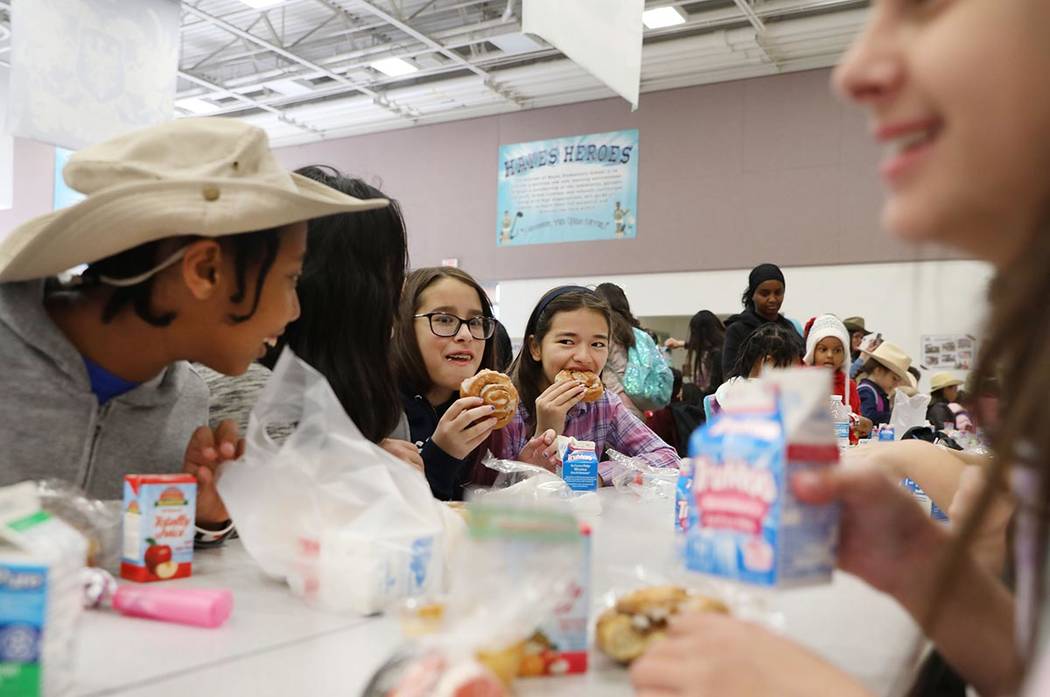 Students eat their breakfast during the Clark County School District's first day of universal f ...