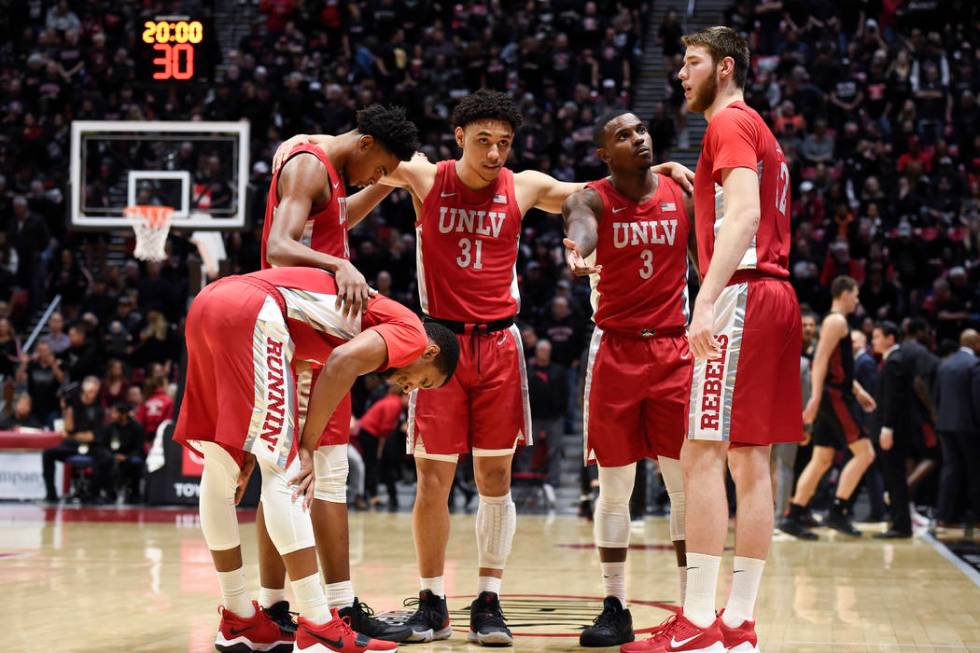 UNLV players huddle before an NCAA college basketball game against San Diego State Saturday, Fe ...