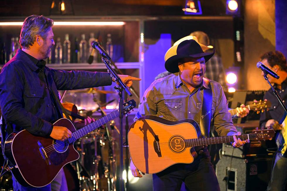 Blake Shelton, left, and Garth Brooks perform "Dive Bar" at the 53rd annual CMA Award ...