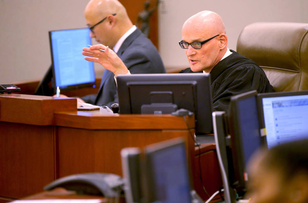 Clark County District Judge Rob Bare presides during a hearing at the Regional Justice Center i ...