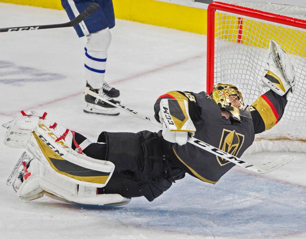 Vegas Golden Knights goaltender Marc-Andre Fleury makes a diving save in the third period again ...