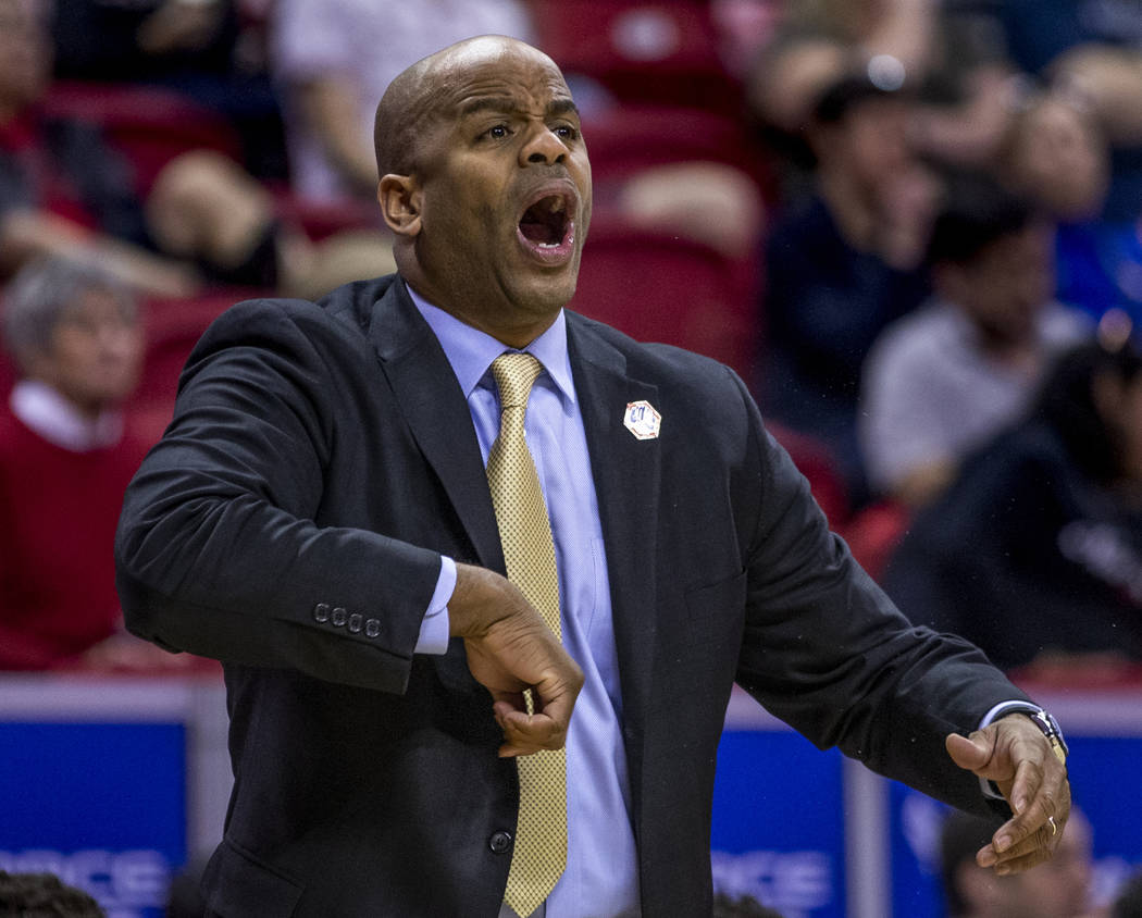 The San Jose State Spartans head coach Jean Prioleau calls in another play in their first half ...