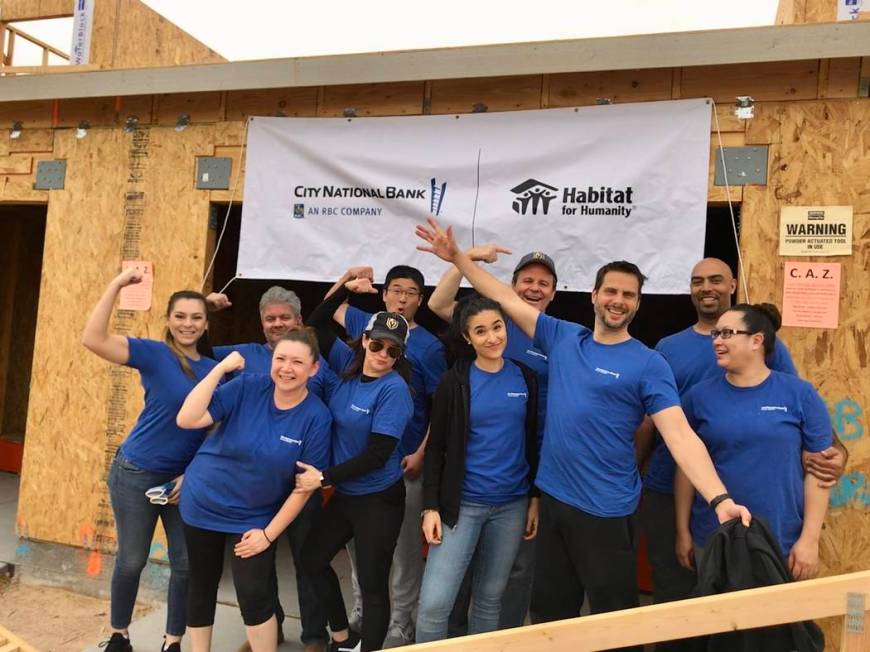 City National Bank colleagues take part in Habitat for Humanity Las Vegas' project with two hom ...