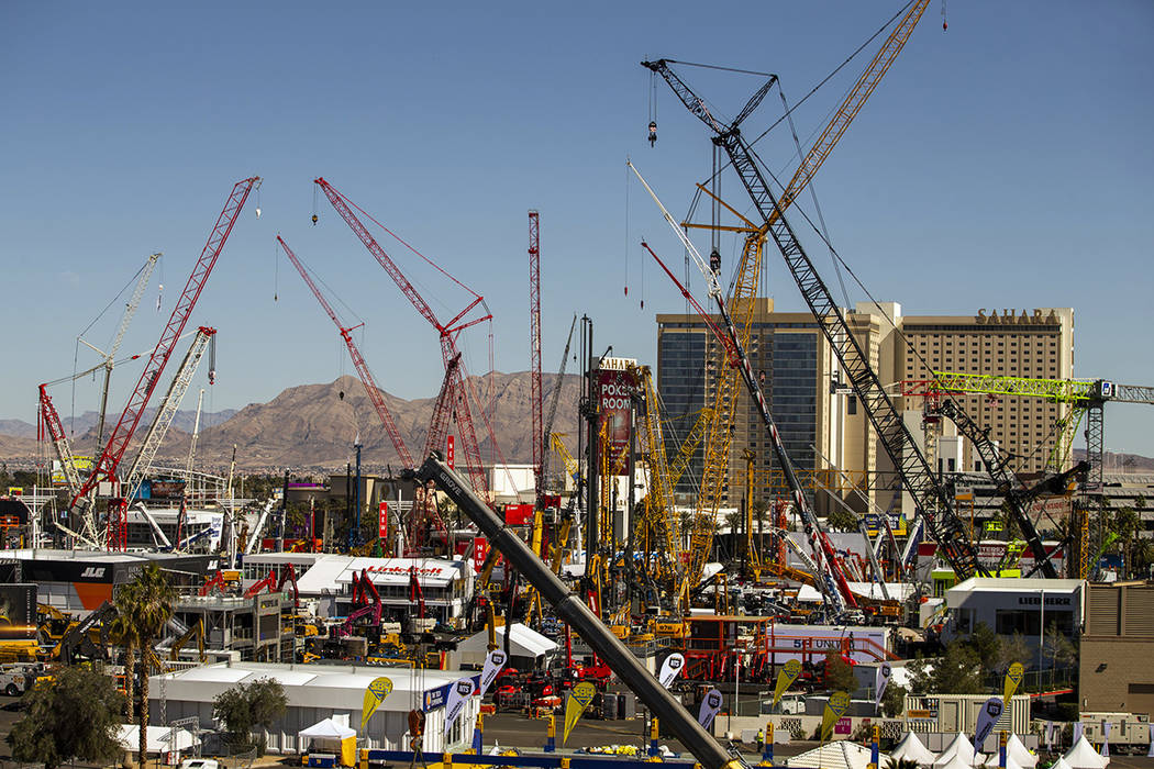 Numerous construction cranes and equipment are in place for the upcoming CONEXPO-CON/AGG event ...