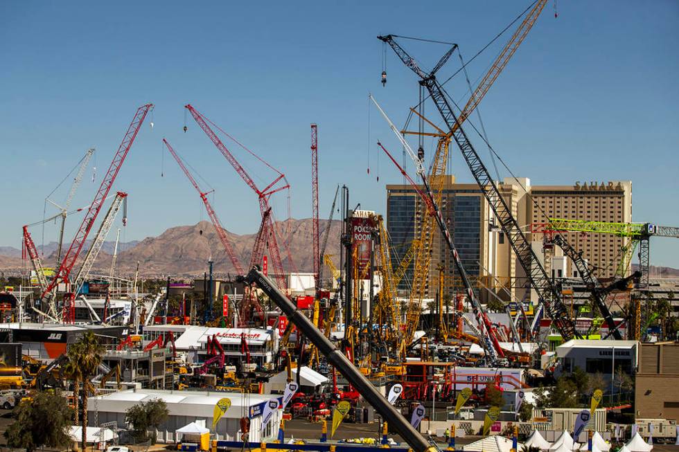 Numerous construction cranes and equipment are in place for the upcoming CONEXPO-CON/AGG event ...