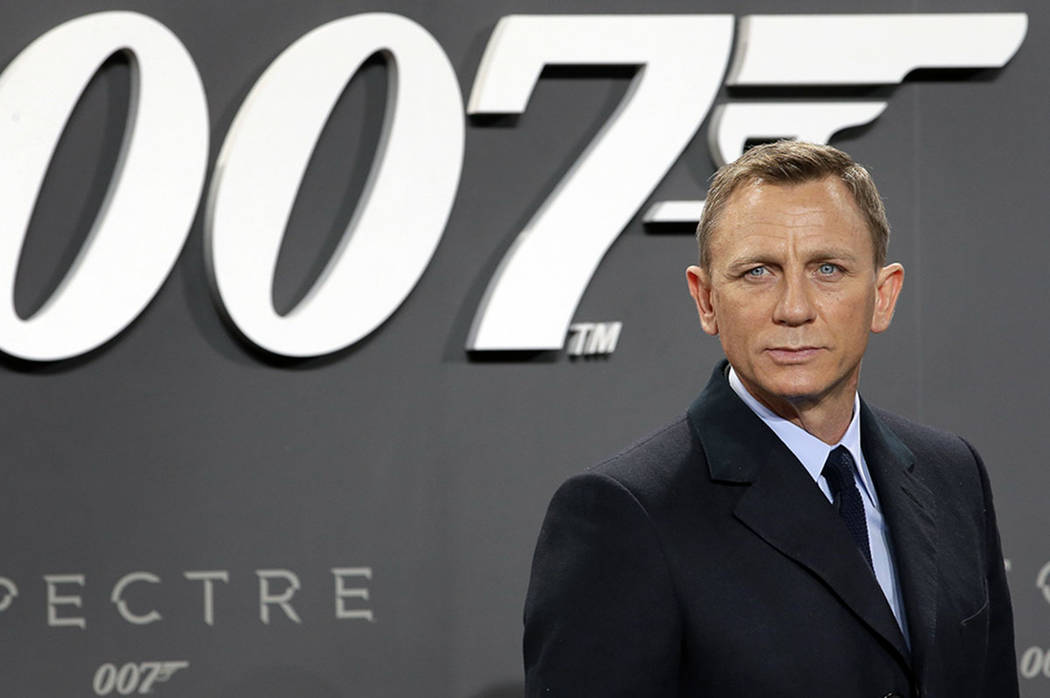 Actor Daniel Craig poses for the media as he arrives for the German premiere of the James Bond ...