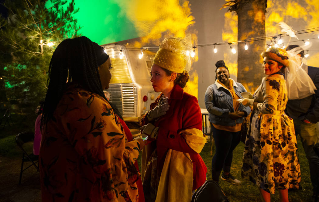 Pansy Stock, played by Rose Donahue, right, interacts with attendee Whitley Wilburn during a dr ...