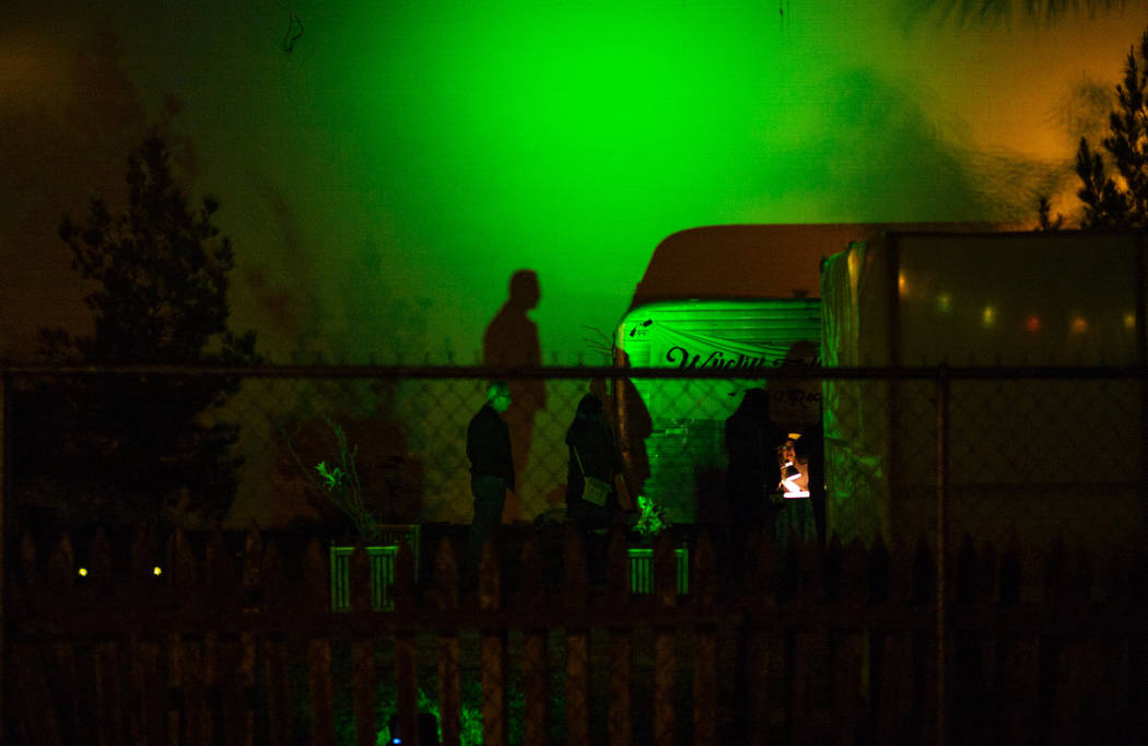 The shadow of an attendee is cast against a wall during a dress rehearsal of "The Garden P ...