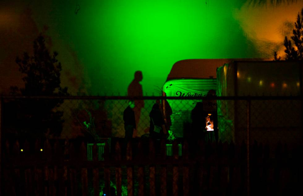 The shadow of an attendee is cast against a wall during a dress rehearsal of "The Garden P ...