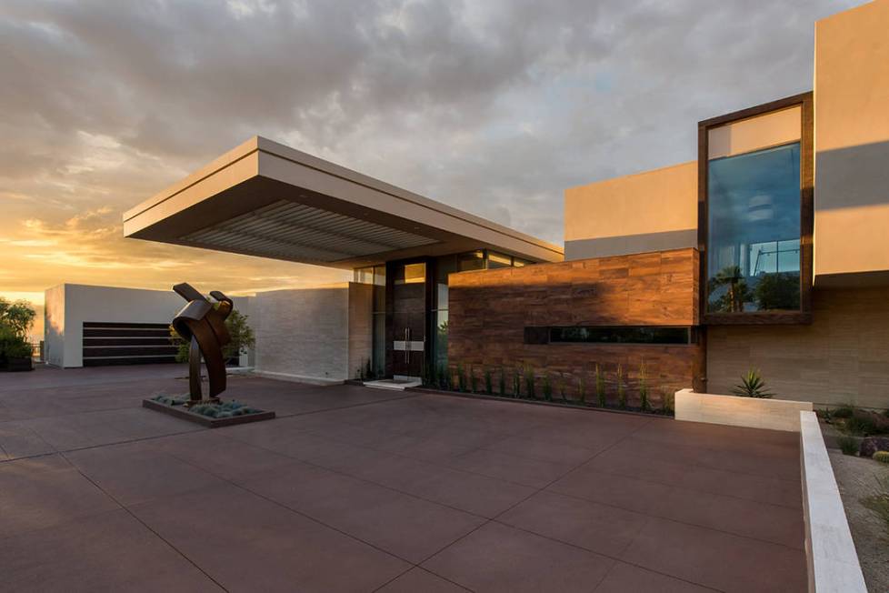 The home features a sculpture at its entrance. (Stephen Morgan)