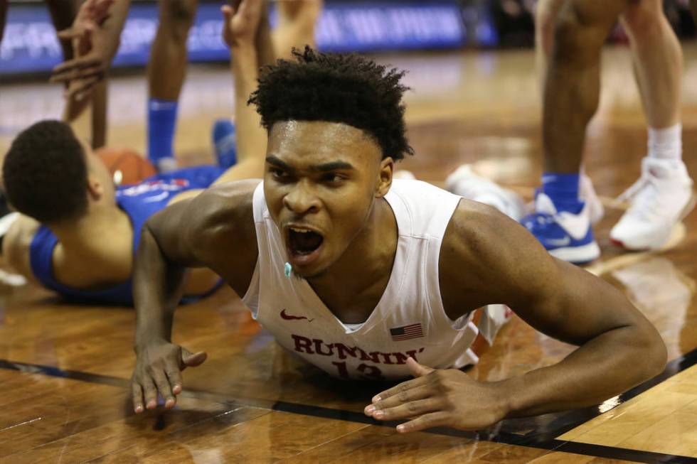 UNLV Rebels guard Amauri Hardy (3) reacts after getting called for a charging foul against Bois ...