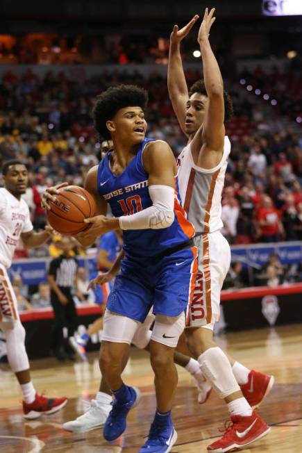 UNLV Rebels guard Marvin Coleman (31) defends against Boise State Broncos guard RayJ Dennis (10 ...