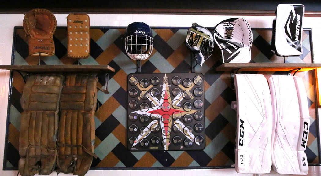 Old hockey gear are displayed at the new sportsbook bar at Park MGM on Friday, March. 6, 2020, ...