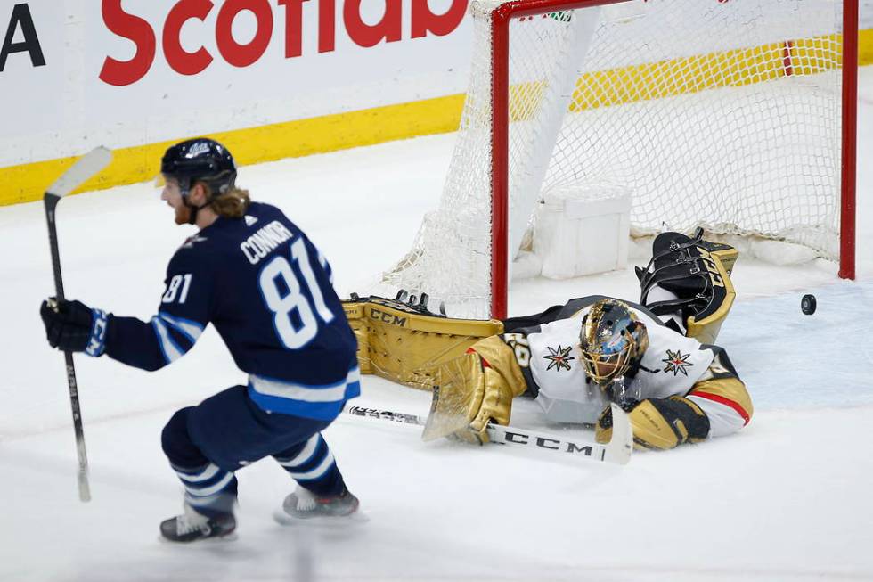 Winnipeg Jets' Kyle Connor (81) scores on Vegas Golden Knights goaltender Marc-Andre Fleury (29 ...