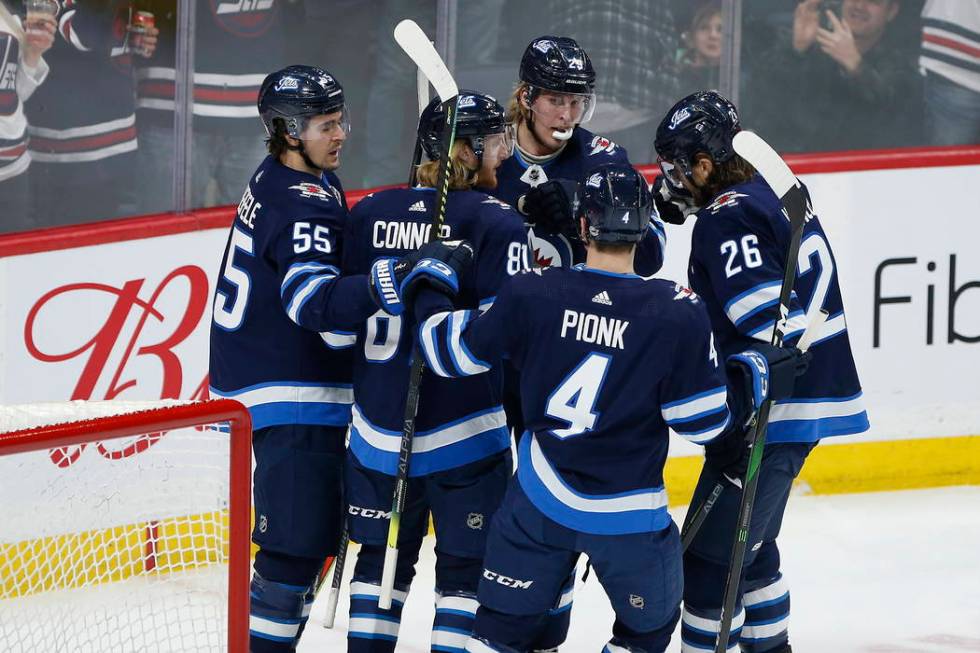 Winnipeg Jets' Mark Scheifele (55), Kyle Connor (81), Patrik Laine (29), Neal Pionk (4) and Bla ...