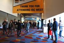 Attendees browse through the International Security Conference & Exposition, also known as ISC ...