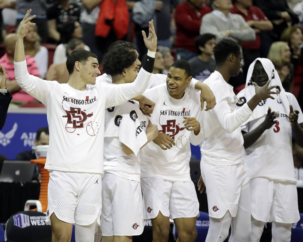 The San Diego State bench reacts during the second half of the team's NCAA college basketball g ...