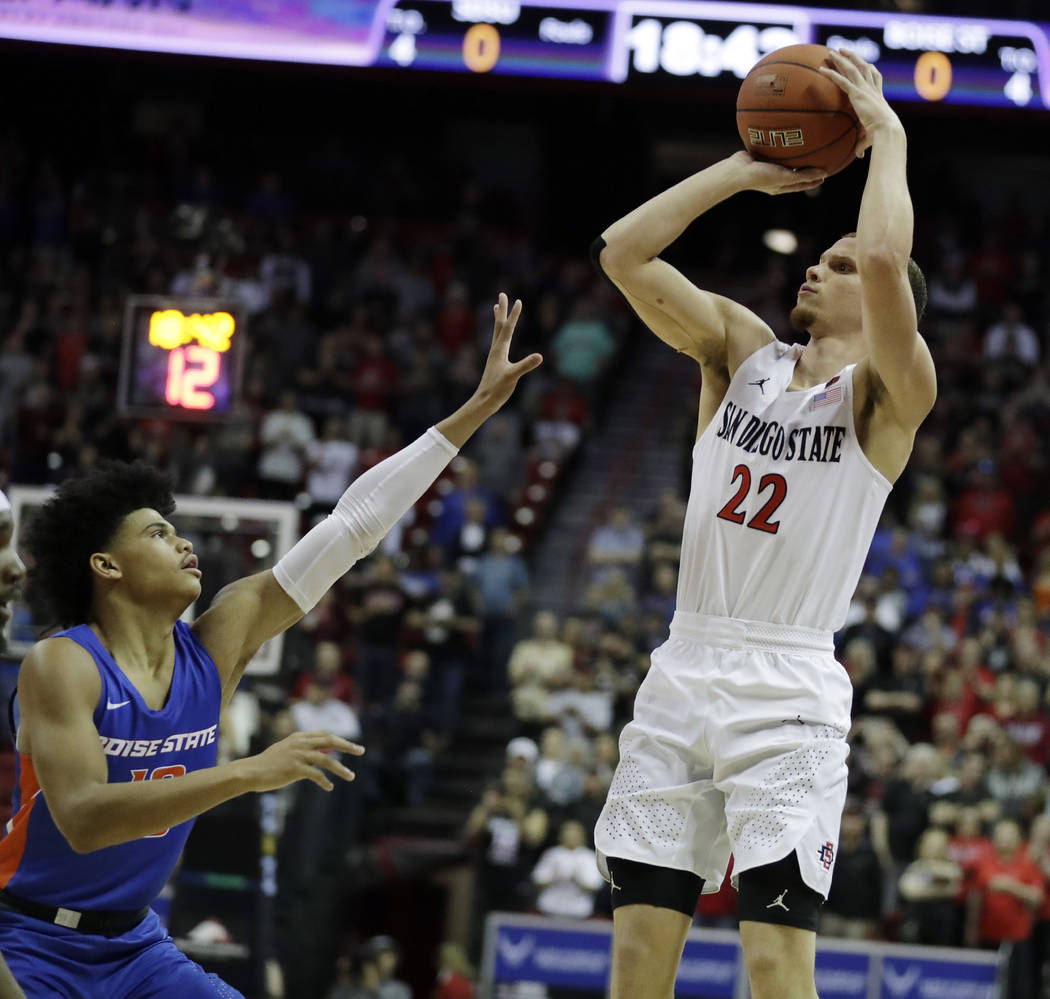 San Diego State's Malachi Flynn shoots as Boise State's Rayj Dennis defends during the first ha ...