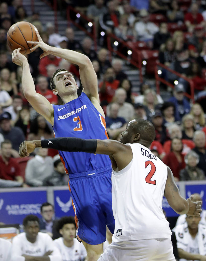 Boise State's Justinian Jessup (3) tries to shoot as San Diego State's Adam Seiko (2) defends d ...