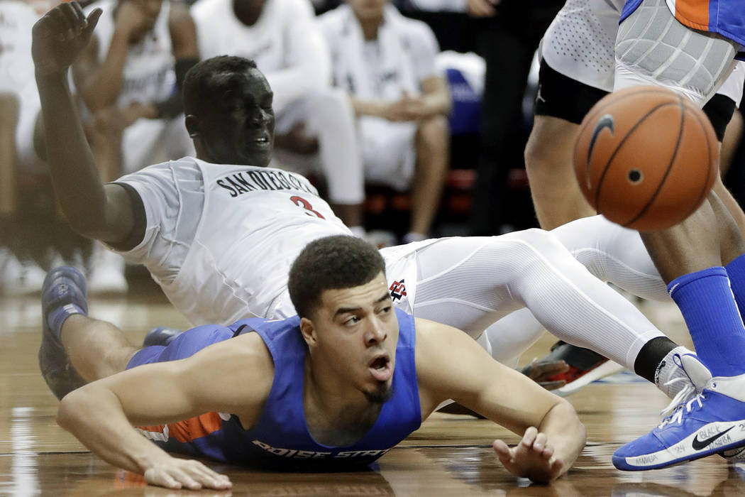 Boise State's Alex Hobbs (34) and San Diego State's Aguek Arop (3) go for a loose ball during t ...