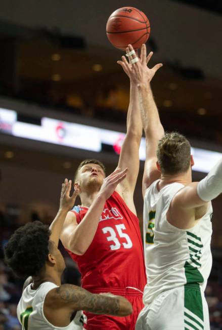 Loyola Marymount Lions forward Ivan Alipiev (35) shoots over San Francisco Dons guard Khalil Sh ...