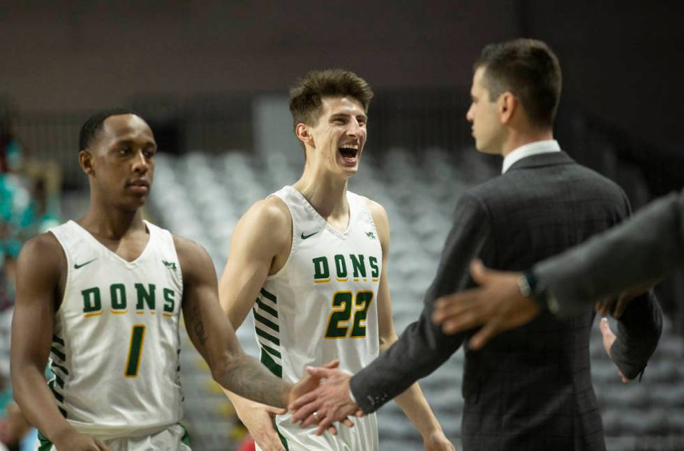 San Francisco Dons guard Jamaree Bouyea (1) and San Francisco Dons forward Dzmitry Ryuny (22) c ...