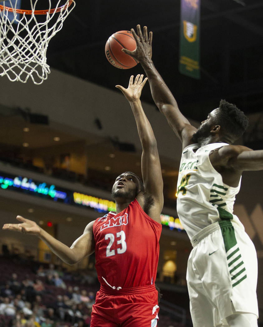 Loyola Marymount Lions forward Jordan Bell (23) drives past San Francisco Dons guard Charles Mi ...