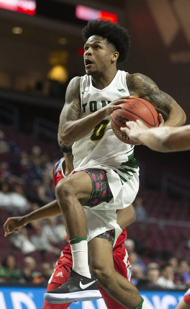 San Francisco Dons guard Khalil Shabazz (0) drives past Loyola Marymount Lions forward Jonathan ...