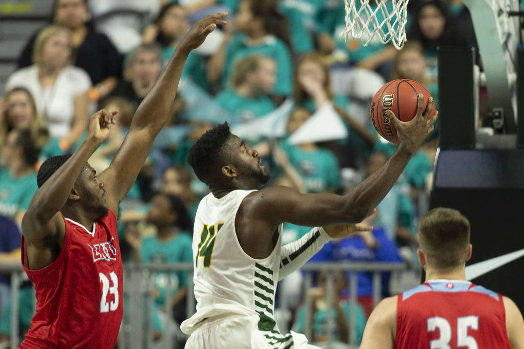 San Francisco Dons guard Charles Minlend (14) drives past Loyola Marymount Lions forward Jordan ...