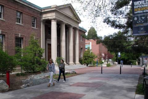 Students on the University of Nevada, Reno's walk past the Mackay School of Mines in 2016 in Re ...