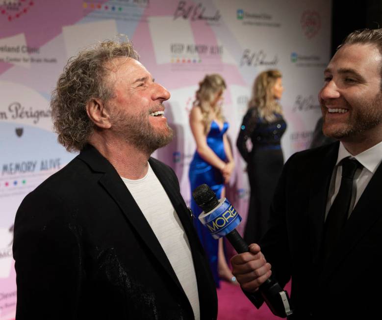 Sammy Hagar, left, talks with the media on the red carpet during the 24th Annual Power of ...