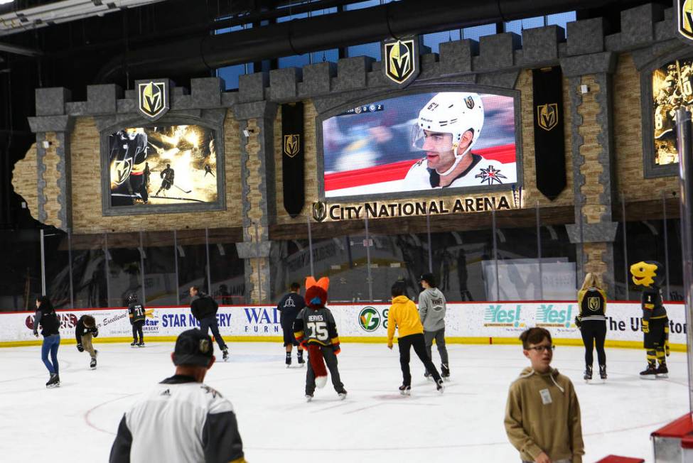 Golden Knights fans skate on the ice at City National Arena during a watch party for an away ga ...