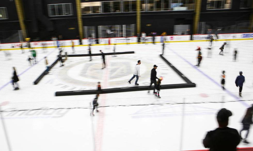 Golden Knights fans skate on the ice at City National Arena during a watch party for an away ga ...