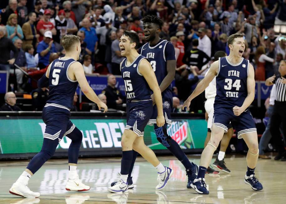 Utah State reacts after Sam Merrill (5) sunk a 3-point basket with seconds remaining in the sec ...