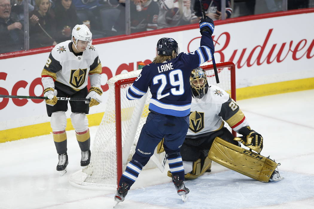 Winnipeg Jets' Patrik Laine (29) celebrates as a shot by Nikolaj Ehlers shot goes in for a goal ...